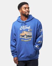 Man wearing a blue hoodie with Ford graphic on a light gray background